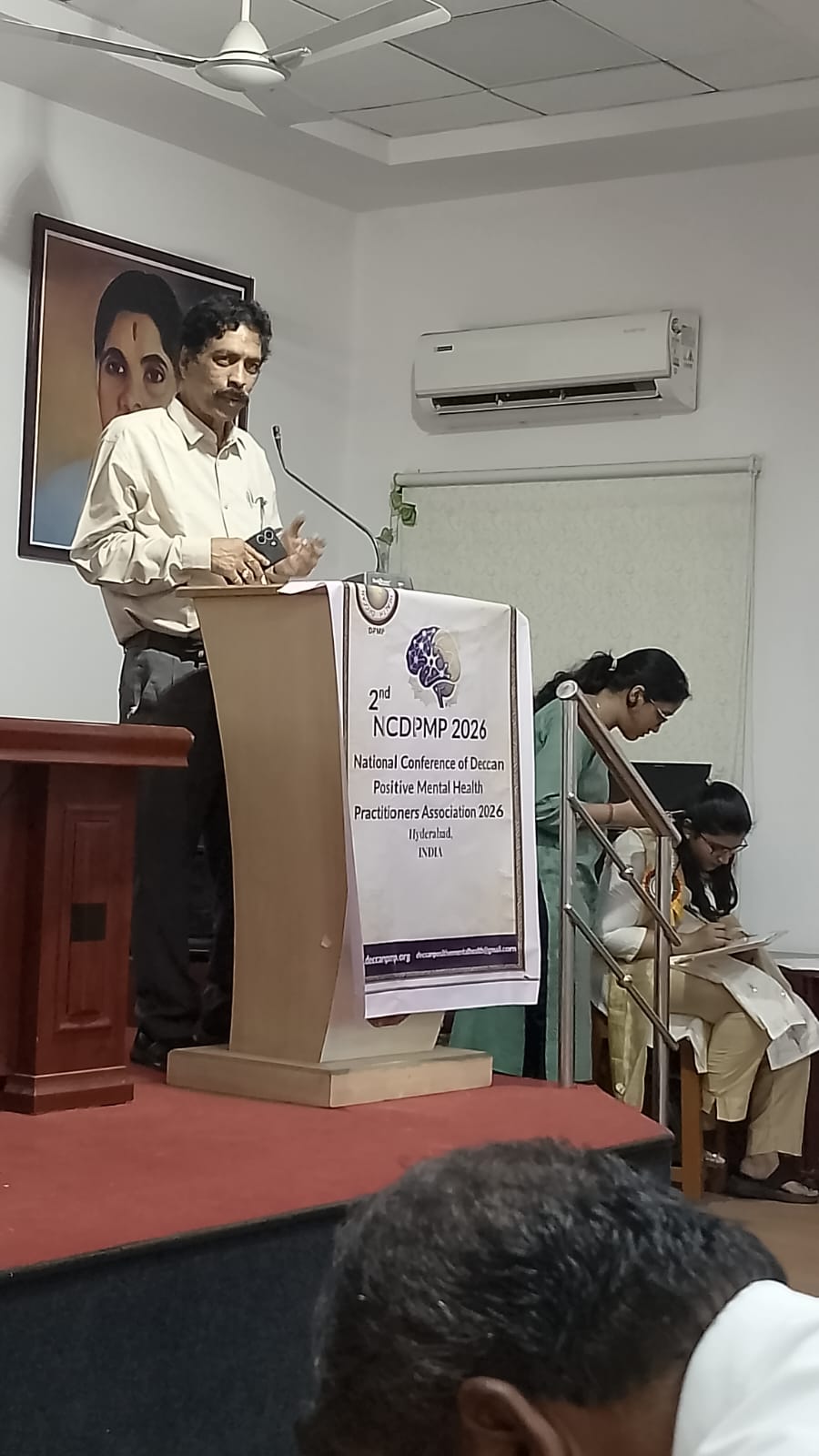 A Jignyasa Foundation trustee speaking at a conference on children's emotional well-being